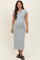 woman wearing a light blue maternity maxi dress with short sleeves and a visible baby bump