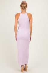 woman wearing a light lavender ribbed sleeveless maxi dress, showing the back view