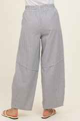 woman wearing blue and white striped wide-leg pants with a comfortable elastic waistband and side seam detailing