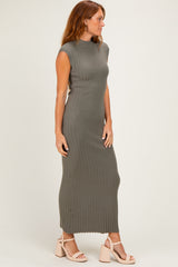 woman wearing a sleeveless olive green ribbed maxi dress and strappy nude heels