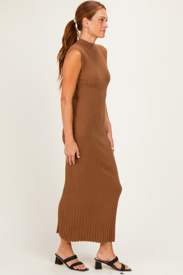 woman wearing a brown ribbed sleeveless maxi dress with a fitted silhouette and low neckline