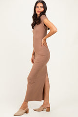 woman wearing a brown short sleeve maxi dress with a side slit and styled with beige mules