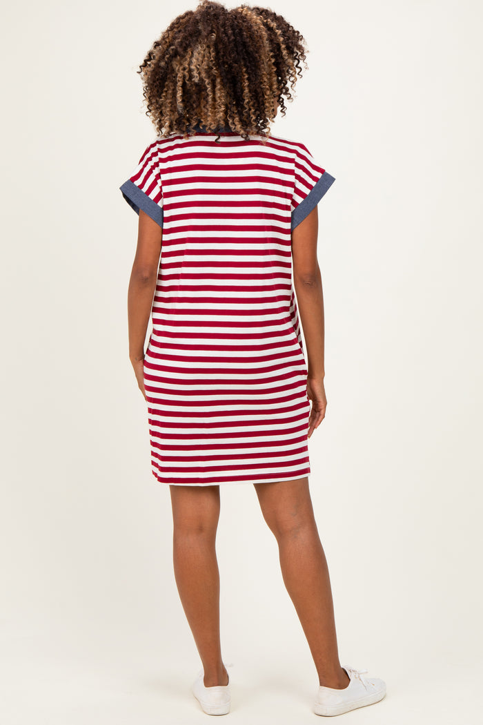 woman wearing a red and white striped maternity dress with navy blue accents, showing a stylish and comfortable back view