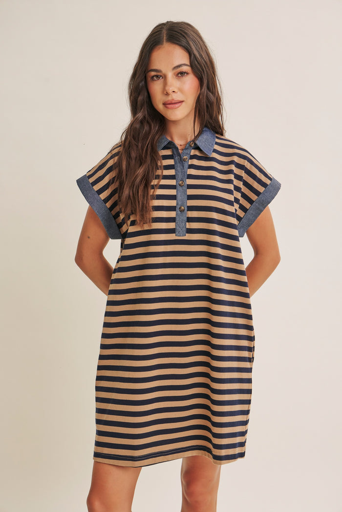 woman wearing a striped polo dress with short sleeves and a denim collar