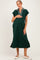 woman wearing a dark green maternity dress with a striped collar and holding her baby bump