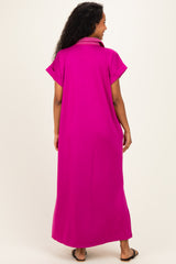 woman wearing a bright pink maternity maxi dress with short sleeves and a collar, viewed from the back