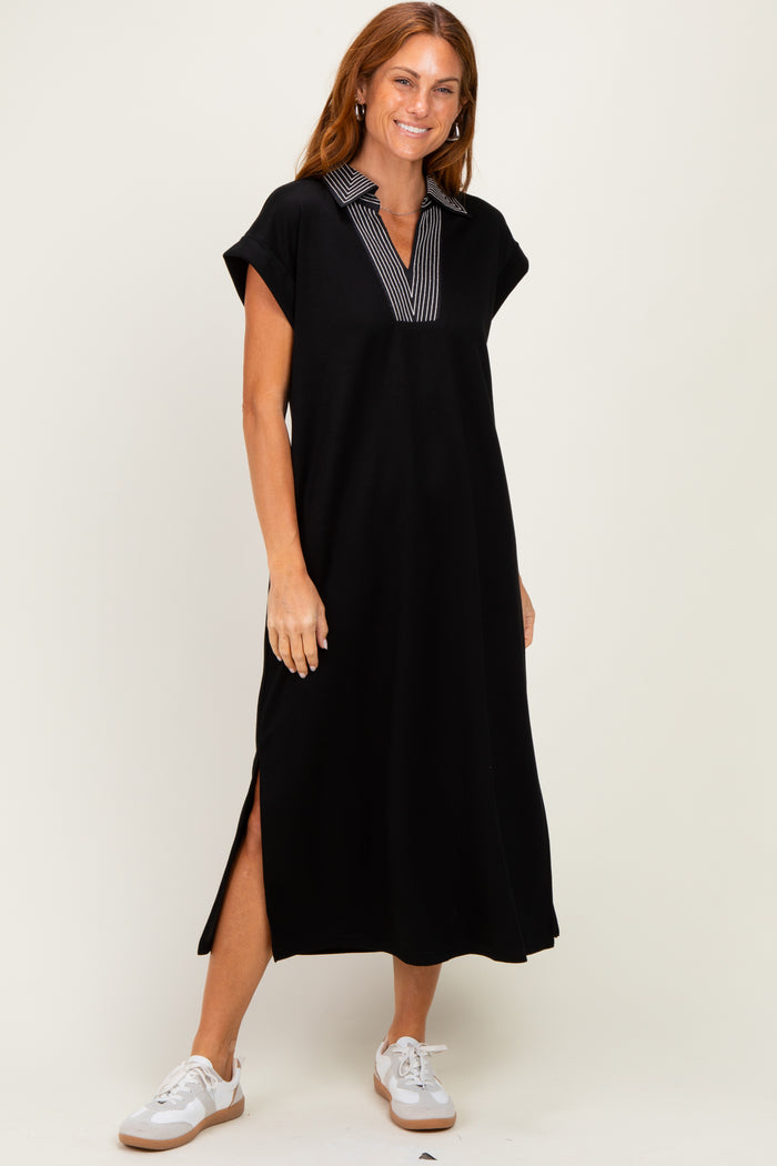 woman wearing a black cap sleeve midi dress with a striped collar and side slits