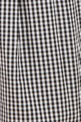black and white gingham maternity wear fabric close-up with pleated details