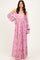 woman wearing a lavender off-shoulder maxi dress with floral print and bell sleeves