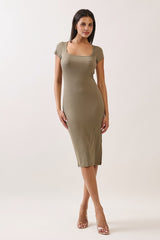 woman wearing a fitted olive green knit midi dress with short sleeves and a square neckline