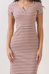 woman wearing a pink and white striped midi dress with a scoop neckline and short sleeves
