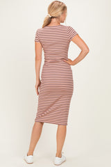 woman wearing a striped midi dress with short sleeves and a fitted silhouette, seen from the back