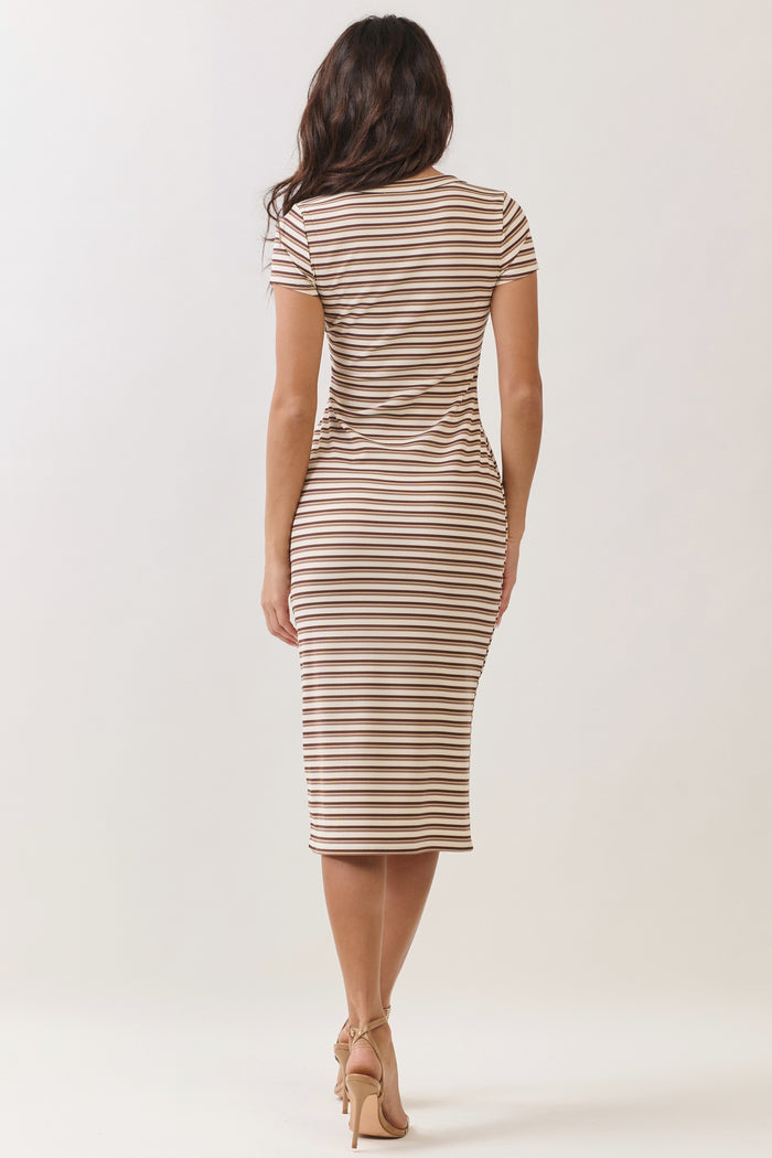 woman wearing a fitted brown and white striped midi dress with short sleeves