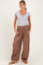 woman wearing a grey short sleeve henley top and brown maternity pants with drawstring and elastic cuffs