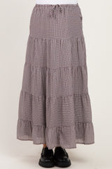 maternity wear tiered maxi skirt in brown and cream gingham pattern with a drawstring waist, styled with black shoes