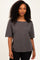 woman wearing a dark gray short sleeve top with a scoop neckline and relaxed fit
