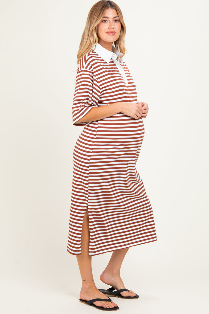 woman wearing a brown and white striped maternity dress with a collared neckline and side slits, showing her baby bump