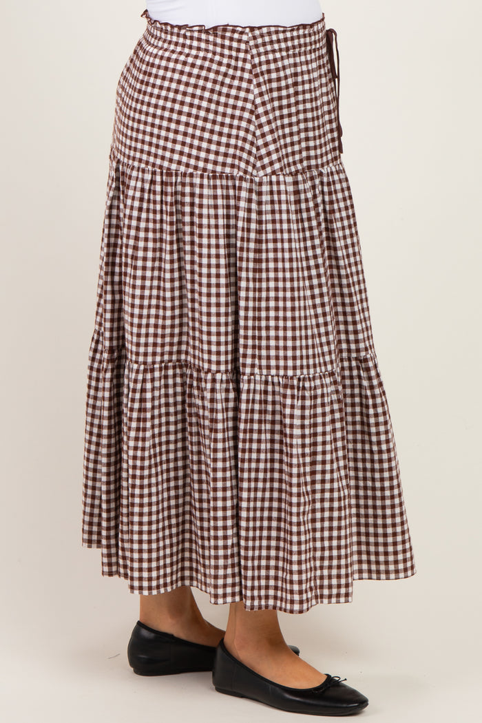 maternity wear brown and white gingham tiered maxi skirt with drawstring waist, model wearing black flat shoes