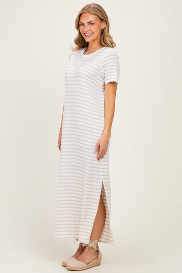 woman wearing a striped short sleeve maxi dress with side slits and a relaxed fit