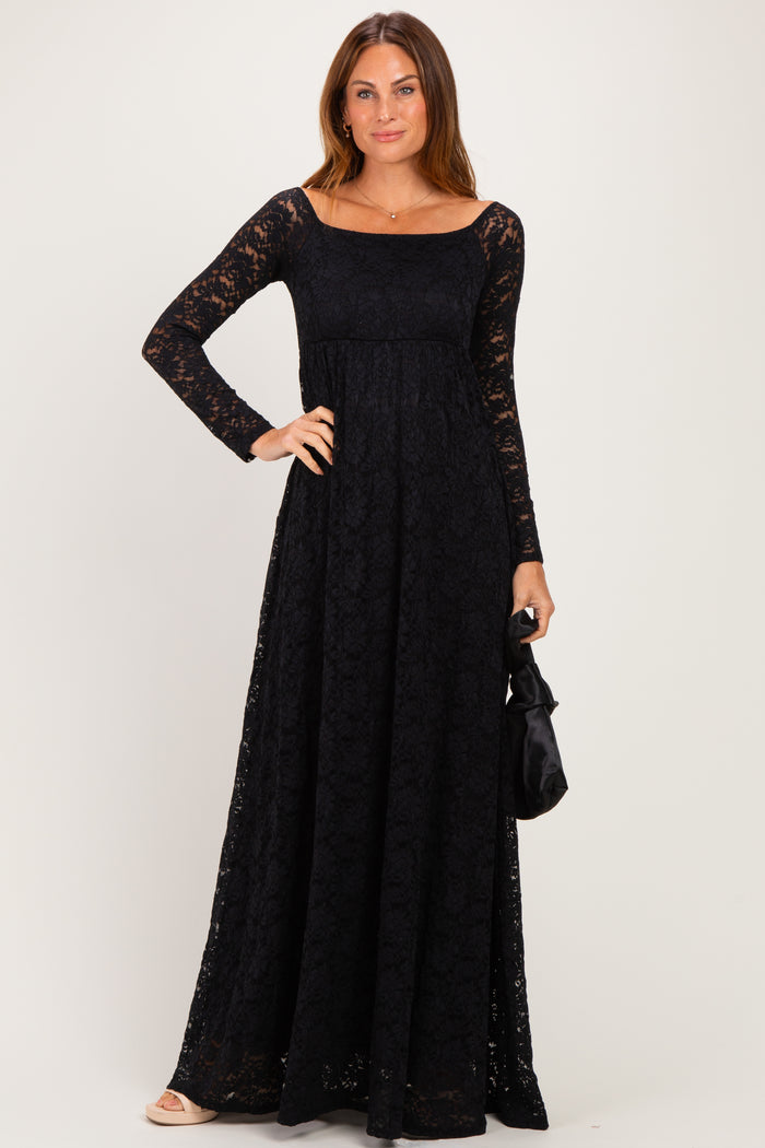 woman wearing a black lace long sleeve maxi dress with a square neckline and a fitted bodice