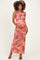 woman wearing a floral printed maternity maxi dress and holding her baby bump