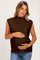 woman wearing a dark brown sleeveless maternity top and cradling her baby bump