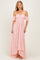 woman wearing a light pink off-the-shoulder lace maxi dress with flutter sleeves and a high-low hemline