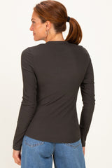 woman wearing a dark grey long sleeve ribbed top with a fitted style and back view