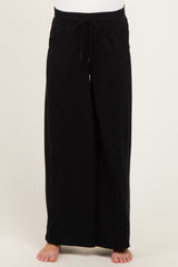 maternity wear black wide-leg pants with adjustable drawstring waist, model showing bare feet