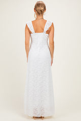 woman wearing a white lace long dress with ruffled straps, shown from the back