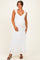 woman wearing a white lace maternity maxi dress with ruffled straps and showing her baby bump