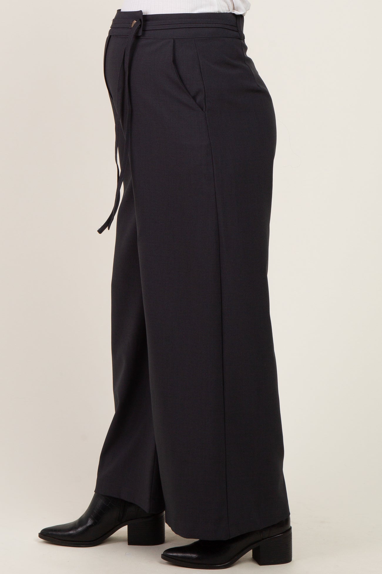 maternity wear in dark gray wide-leg trousers featuring a high waistband and adjustable drawstring, model shown from the side