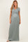 woman wearing a teal short sleeve maternity maxi dress with a gathered waist and visible baby bump