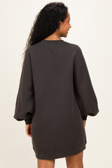 woman wearing a dark gray maternity sweatshirt dress with balloon sleeves, showcasing a relaxed fit from the back