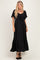 woman wearing a black maxi dress with short flutter sleeves and a tie front detail