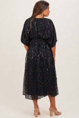 maternity wear black sheer midi dress with flutter sleeves and a fitted waist, model showing the back view