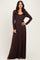 woman wearing a long sleeve dark brown maxi dress with a fitted bodice and flowing skirt