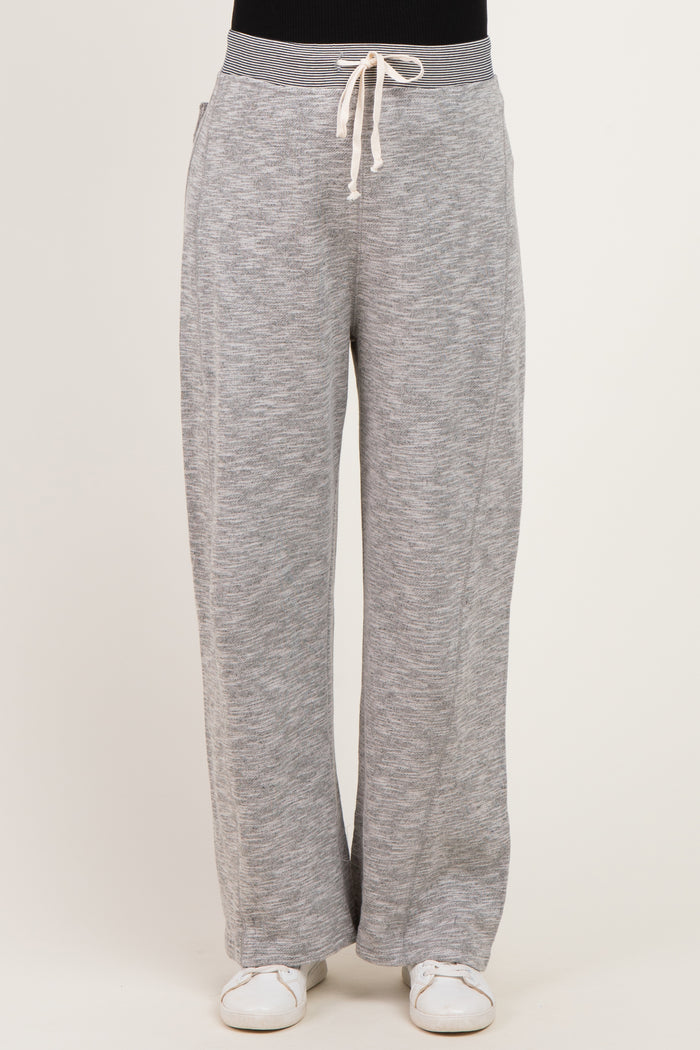 woman wearing gray maternity lounge pants with a drawstring waistband