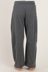 woman wearing gray wide-leg lounge pants with an elastic waistband, viewed from the back