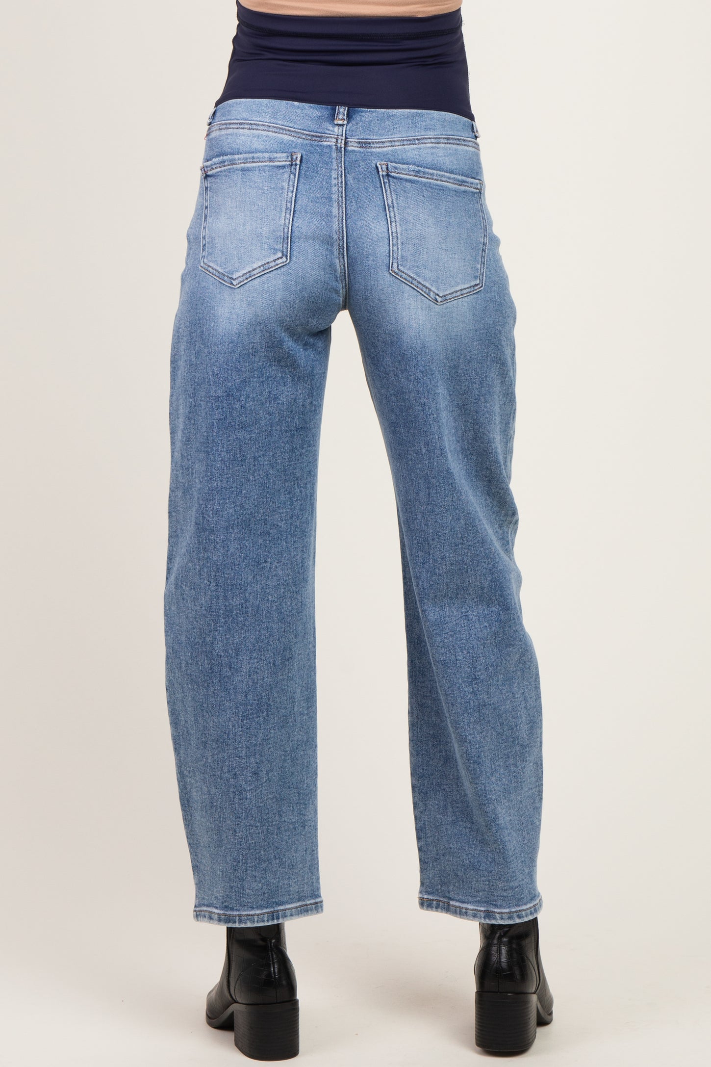 woman wearing light blue maternity wide-leg jeans from the back