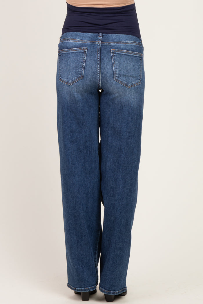 woman wearing dark blue maternity jeans with a stretchy waistband, seen from the back