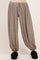 maternity wear striped harem pants with an elastic waist and cuffed ankles, model wearing fuzzy slippers