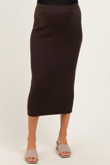maternity wear brown ribbed midi skirt worn by a model with strappy beige sandals