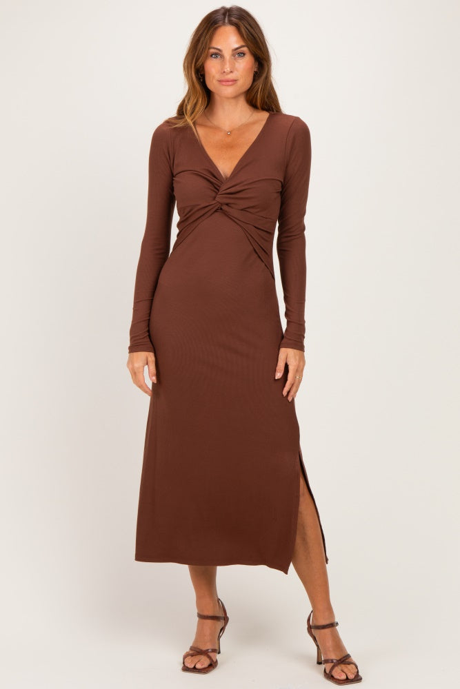 woman wearing a brown long sleeve maxi dress with a twist front and a side slit