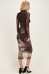woman wearing a long sleeve bodycon dress with a sheer brown floral design showing a fitted silhouette from the back