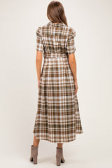 woman wearing a brown and cream plaid maternity dress with a tie waist, shown from the back