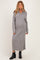 woman wearing a gray long sleeve maternity sweater dress with a collar and a visible baby bump