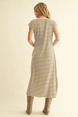 woman wearing a beige and black striped maxi dress, showing the back with cap sleeves and side slits