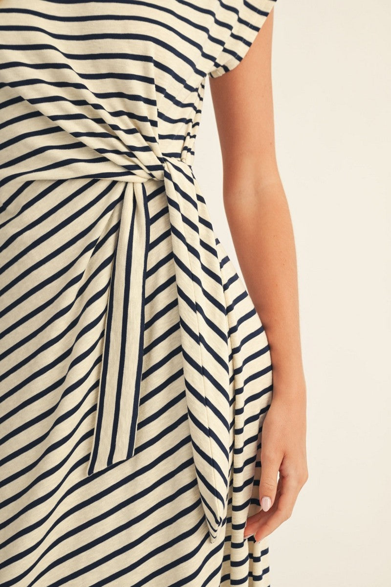 woman wearing a striped midi dress with a tied waist detail