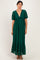 woman wearing a green lace maxi dress with short sleeves and ruffled details.